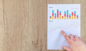 person-pointing-paper-line-graph-590041 Photo by Lukas Blazek-660x395